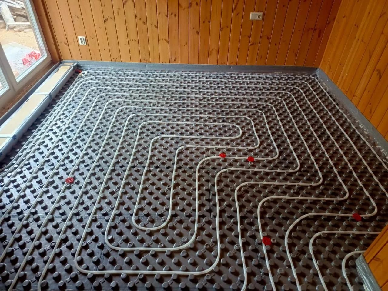 Installation of Hydronic Underfloor Heating in a Frame House 4